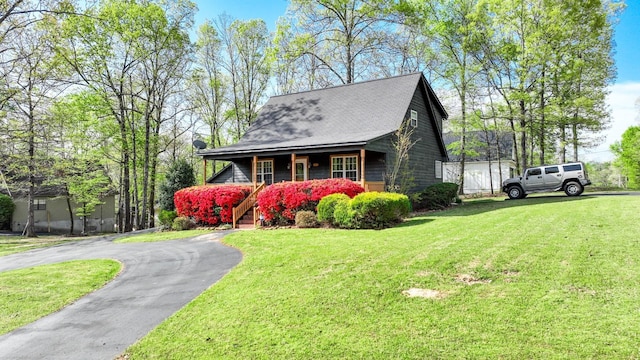10 Rising Sun Ln, Counce, TN 38326 - view of property exterior with a lawn, a porch, and aphalt driveway