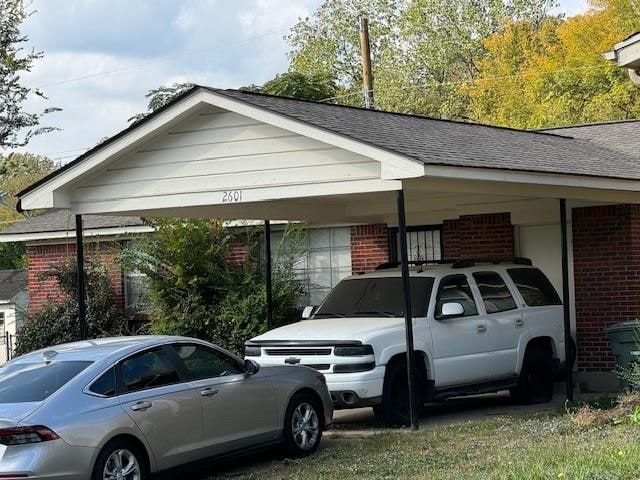 view of parking / parking lot with a carport