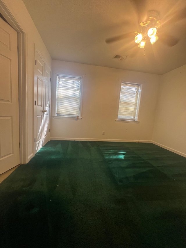 unfurnished room featuring carpet flooring and ceiling fan