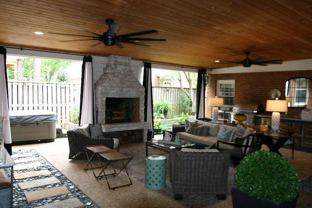 view of patio featuring area for grilling, an outdoor living space with a fireplace, and ceiling fan