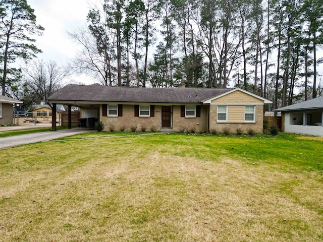 ranch-style home featuring a front lawn and a carport