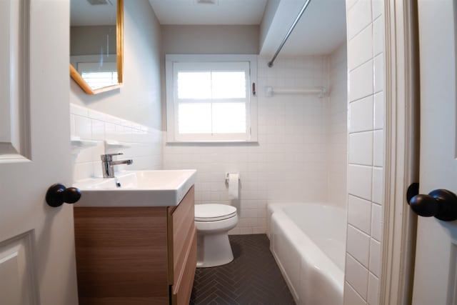 4543 Charleswood Ave, Memphis, TN 38117 - full bathroom with vanity, toilet, tiled shower / bath combo, and tile walls