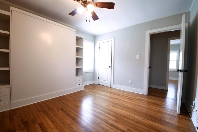 4543 Charleswood Ave, Memphis, TN 38117 - unfurnished bedroom featuring hardwood / wood-style floors and ceiling fan