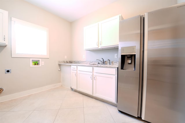 4543 Charleswood Ave, Memphis, TN 38117 - laundry area featuring hookup for an electric dryer, sink, washer hookup, and light tile patterned floors