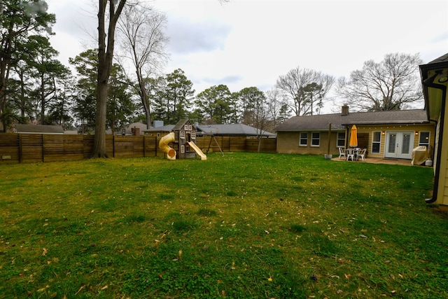 view of yard with a patio area and a playground