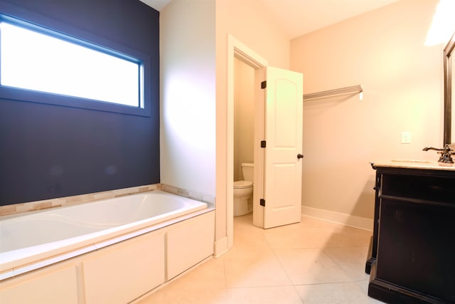 4543 Charleswood Ave, Memphis, TN 38117 - bathroom with toilet, a tub to relax in, vanity, and tile patterned floors