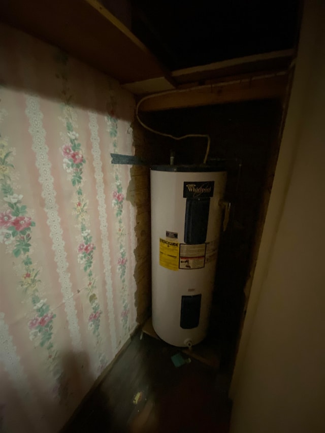 utility room featuring water heater