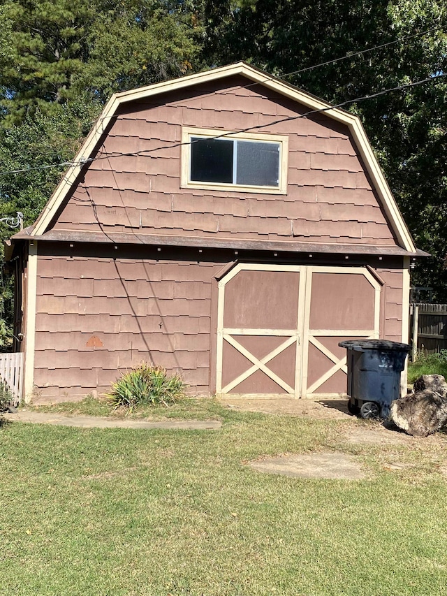 view of outbuilding with a yard