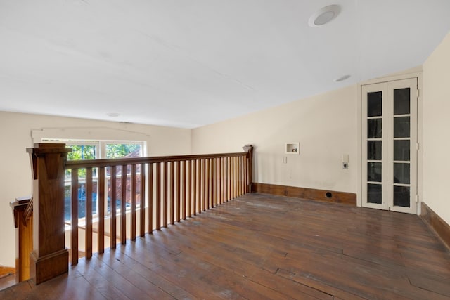 interior space featuring vaulted ceiling and dark hardwood / wood-style flooring