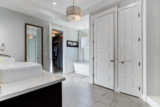 bathroom with vanity, plus walk in shower, and tile patterned flooring