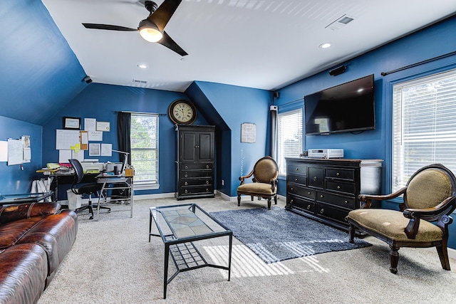 carpeted living room featuring lofted ceiling, ceiling fan, and plenty of natural light