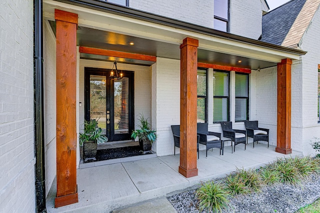 doorway to property featuring covered porch