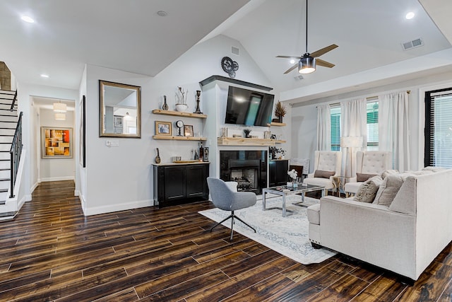 living room featuring ceiling fan, high vaulted ceiling, and dark hardwood / wood-style flooring