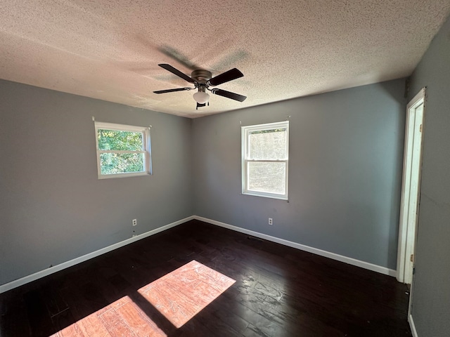 unfurnished room featuring a textured ceiling, dark hardwood / wood-style floors, and ceiling fan