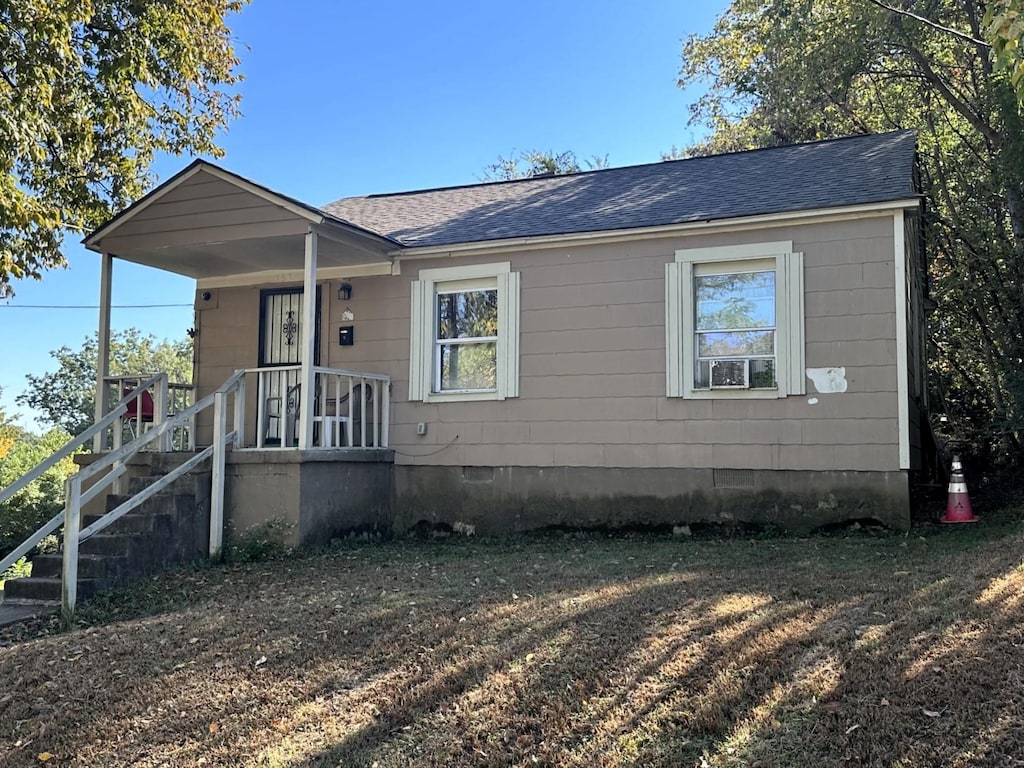 163 W Mckellar Ave, Memphis, TN 38109 - view of front of property with crawl space and a shingled roof