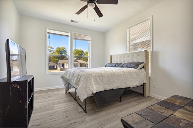 bedroom featuring light hardwood / wood-style flooring and ceiling fan