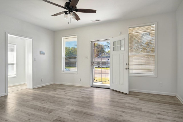 spare room with light hardwood / wood-style floors and ceiling fan