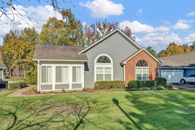 exterior space featuring a front yard and a garage