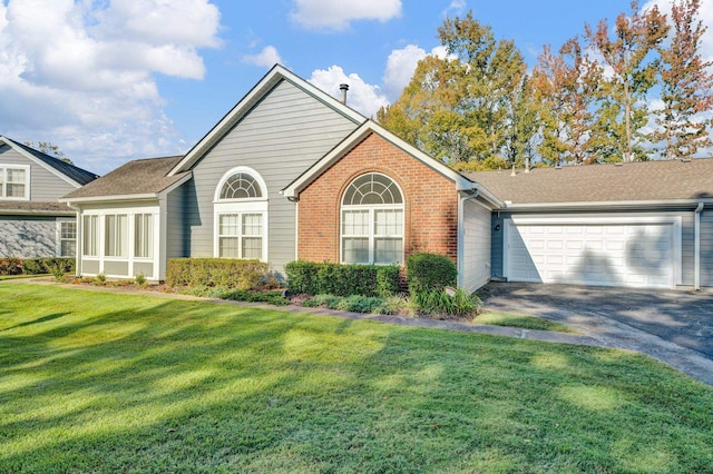 view of front facade with a front lawn and a garage