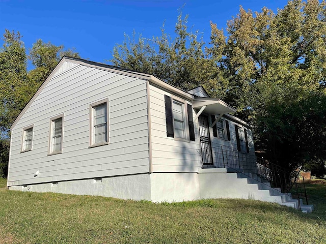 view of property exterior featuring a yard