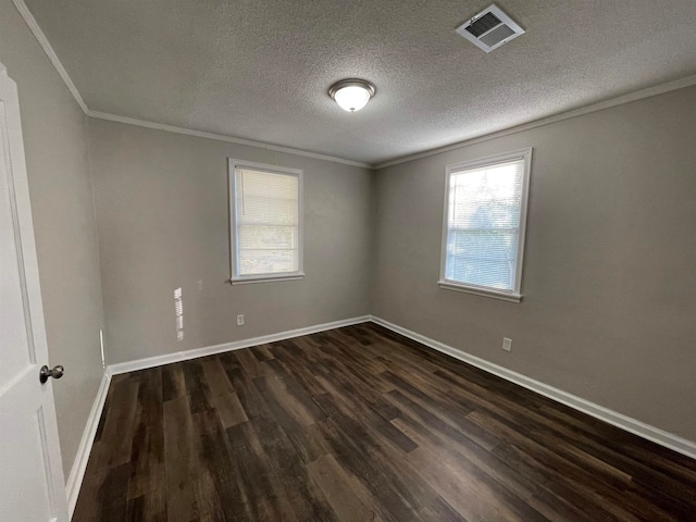 unfurnished room featuring ornamental molding, dark hardwood / wood-style floors, and a textured ceiling