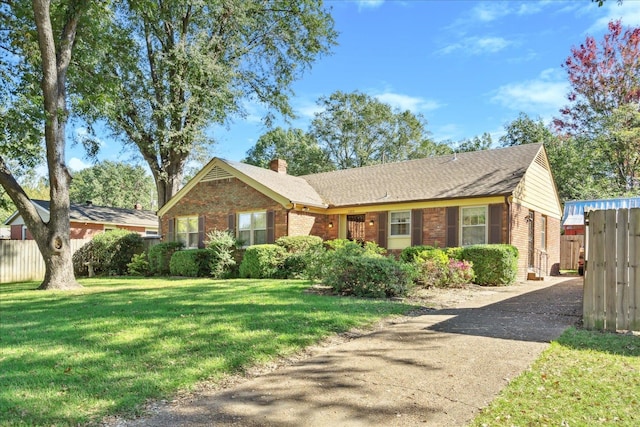 single story home with a front yard