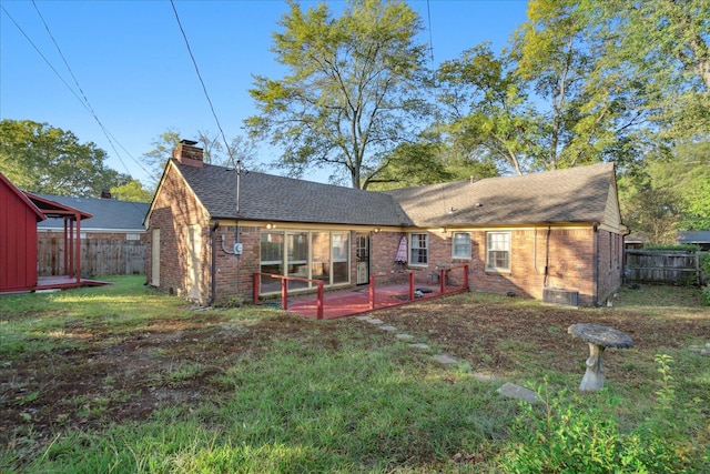 back of house featuring a yard and a patio area