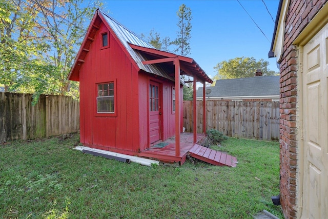 view of outbuilding with a lawn