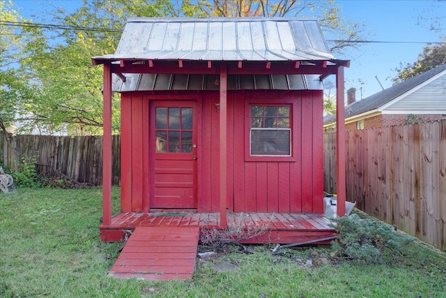 view of outbuilding with a yard