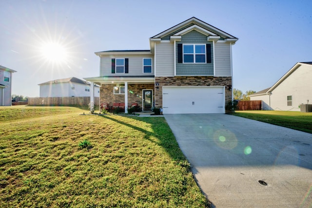 view of front of property featuring central AC, a front yard, and a garage