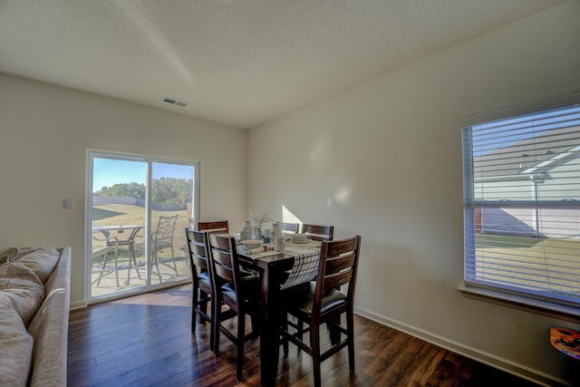 dining room featuring dark wood-type flooring