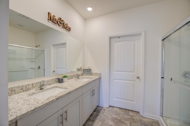 bathroom with vanity and walk in shower