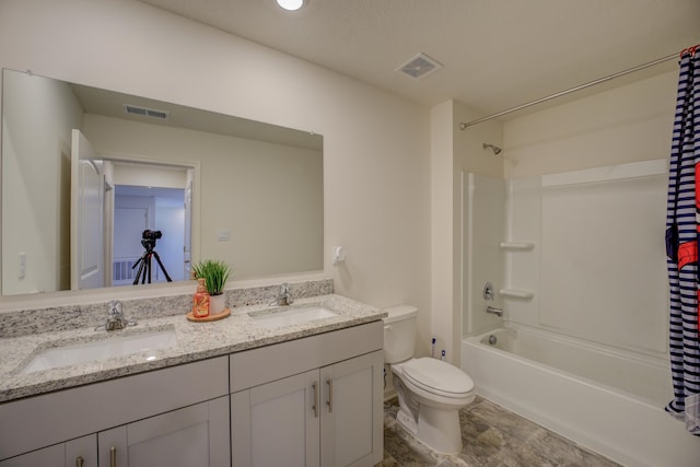 full bathroom with vanity, shower / bath combo with shower curtain, and toilet