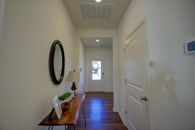 doorway to outside featuring dark wood-type flooring