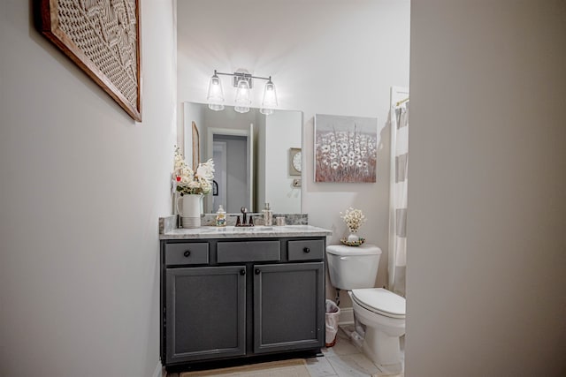 bathroom with vanity, toilet, and a shower with curtain