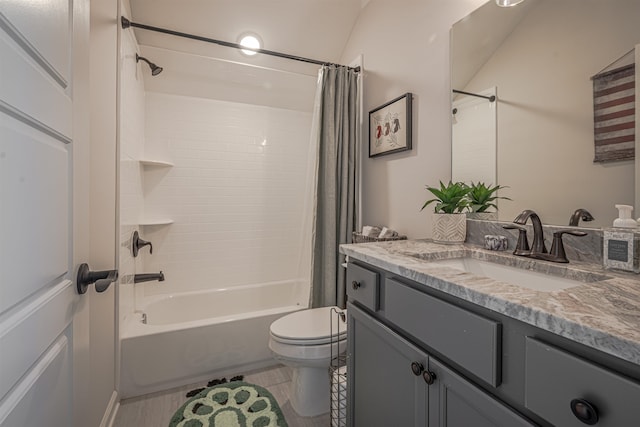 full bathroom with vanity, shower / bath combo with shower curtain, toilet, and tile patterned flooring