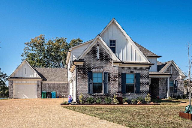 view of front of home with a front lawn and a garage