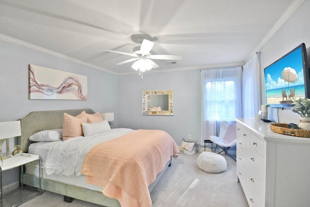 bedroom featuring ceiling fan, crown molding, and light carpet
