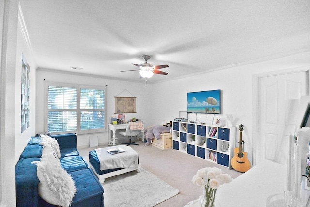 carpeted living area featuring crown molding, a ceiling fan, visible vents, and a textured ceiling