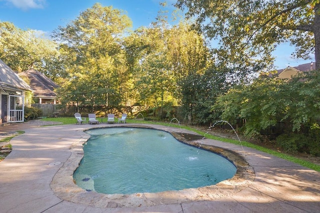 view of swimming pool featuring fence, a fenced in pool, and a patio area
