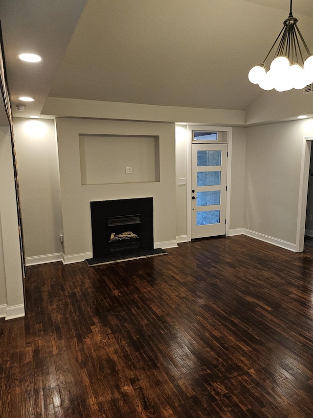 unfurnished living room featuring dark wood-type flooring