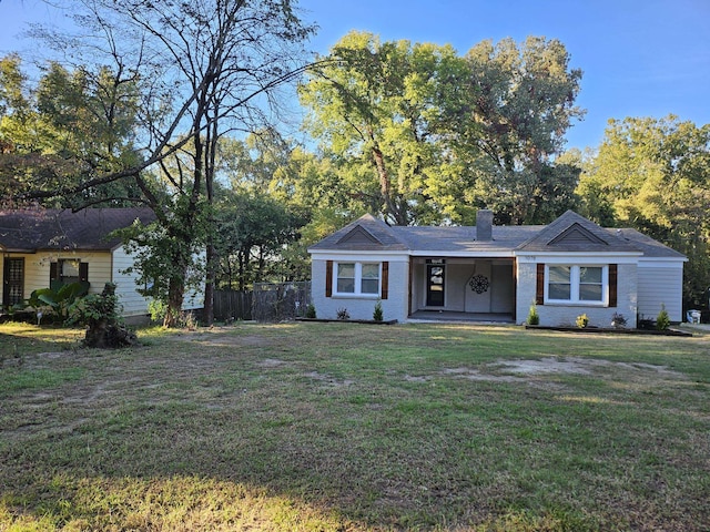 ranch-style home with a front lawn