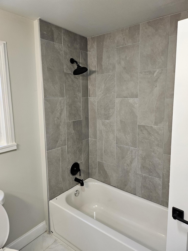 1078 N Ball Rd, Memphis, TN 38106 - bathroom featuring shower / bath combination, baseboards, toilet, and marble finish floor