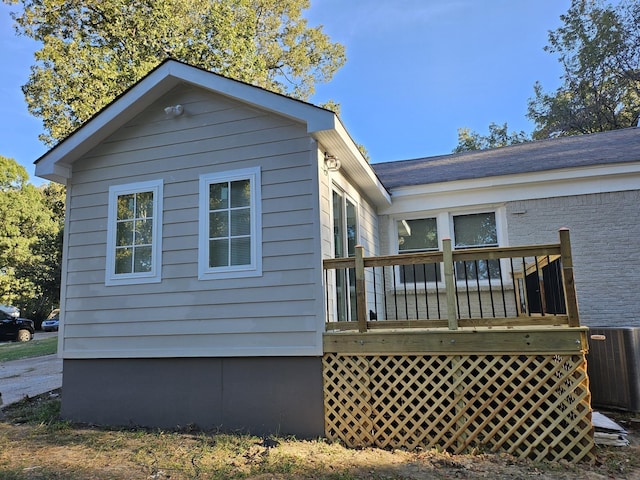 1078 N Ball Rd, Memphis, TN 38106 - back of house with central air condition unit and a wooden deck