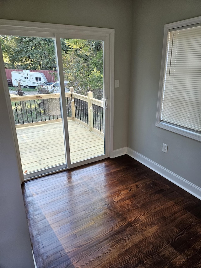 1078 N Ball Rd, Memphis, TN 38106 - doorway to outside with dark wood-style flooring and baseboards