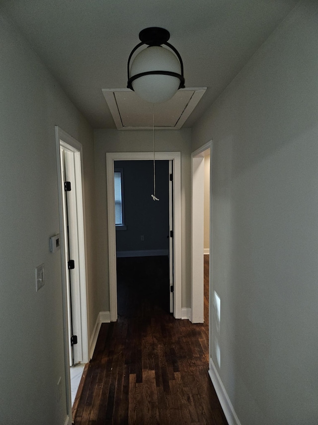 1078 N Ball Rd, Memphis, TN 38106 - corridor featuring baseboards, attic access, and wood finished floors