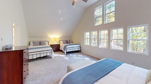 bedroom with light carpet, multiple windows, and ceiling fan