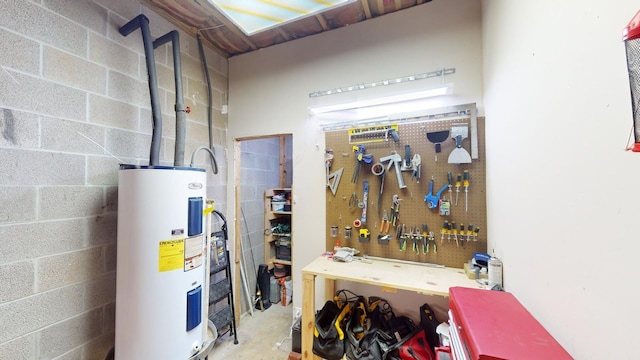 utility room with electric water heater