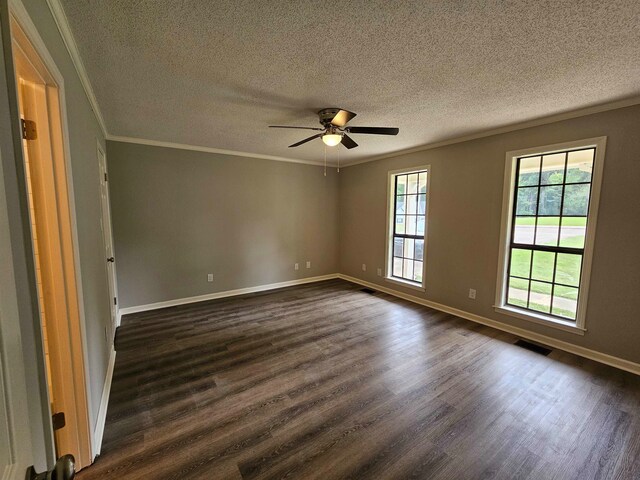 spare room featuring ceiling fan, crown molding, a textured ceiling, and dark hardwood / wood-style floors