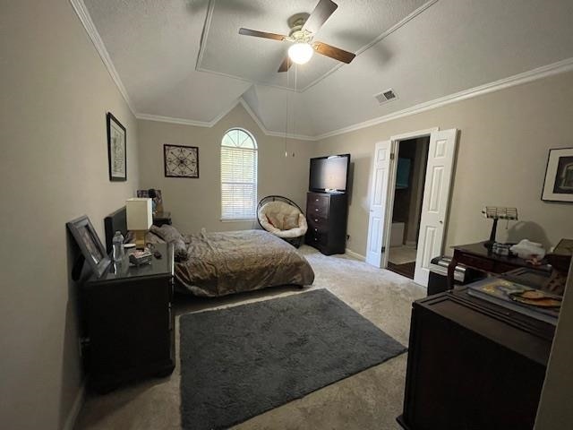 bedroom with a textured ceiling, ceiling fan, lofted ceiling, ornamental molding, and light colored carpet